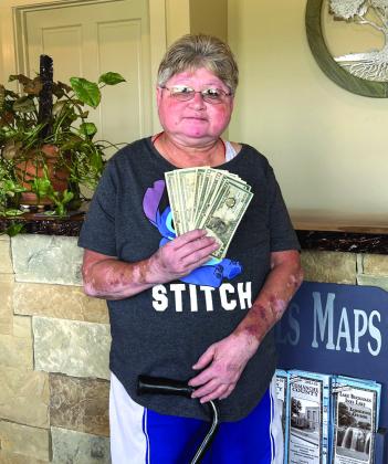 Pictured at right: Lydia Turner - July winner of the San Saba County Chamber of Commerce Chamber Bucks giveaway