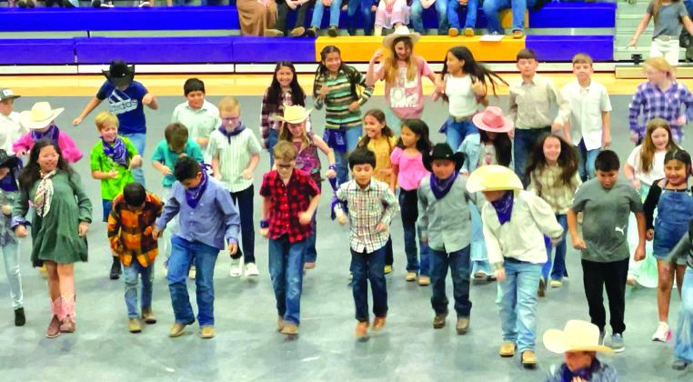 3rd and 4th grade students performing a line dance at the 2nd Annual San Saba Showdown