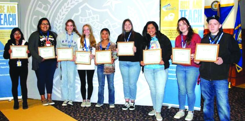 Dejah Vasquez from San Saba High School, pictured second from the left, received an H-E-B $500 Scholarship.