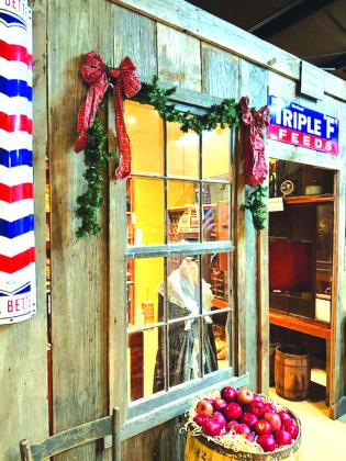 A barrel of apples welcomes you at the entrance of the 'General Store' display Photo by Aileen Roberts