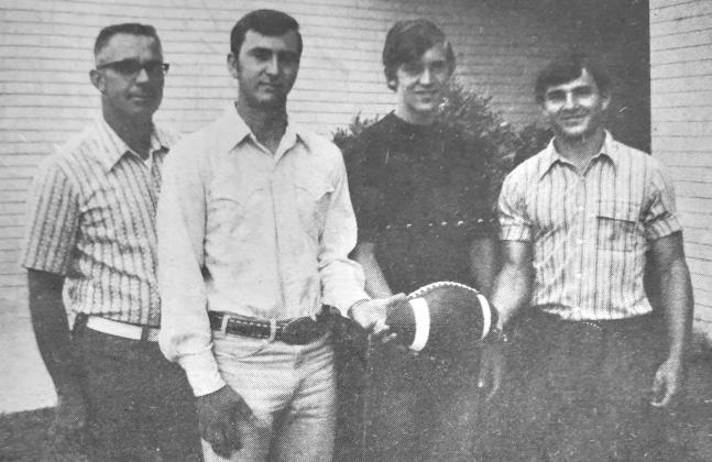 SAN SABA LEADERS–Members of the San Saba Golden Armadillos have selected tri-captains for the 1973 football season. From left to right are Coach John Baskin, athletic director and head football coach, with captains Hardy Stewardson, Mark Geldmeier and Rodney Norris. In 1972 San Saba won 6 and lost four for the best season record and tied for second in the district.