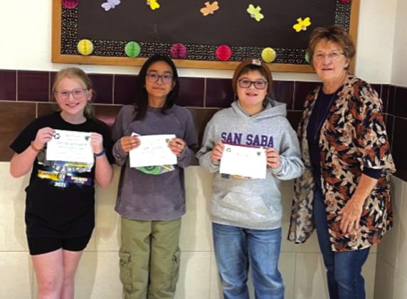 Sculpture from Recyclables Contest 4th grade: (l-r) Everleigh Vallenavedo-2nd place, Kamila Estrada-3rd place, Wyatt Ward-1st place, Debbie Shahan-award presenter