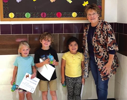Poetry Contest Kindergarten SSES: (l-r) Lacy Johnson-1st place; Turner Hensley-2nd place, Karla Ferrer-3rd place, Debbie Shahan-award presenter