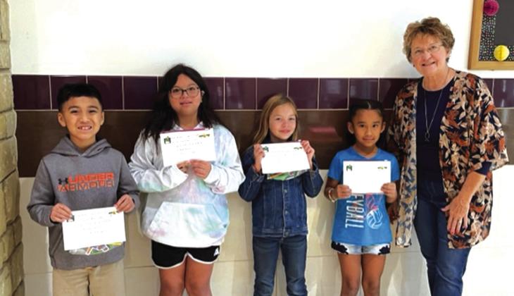 3rd Grade National Forest Service Poster Contest: (l-r) Ubaldo Mendoza-3rd place, Emarie Gomez-1st place, Clara Murray-1st place, Alexa Espinosa-2nd place, Debbie Shahan-award presenter