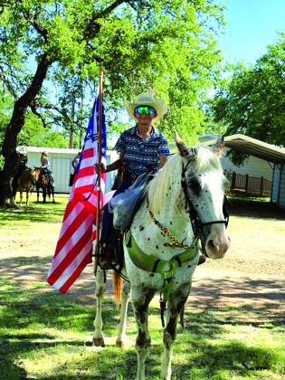 Gus Latta with the Best Cowboy Award was carrying our colors in the parade.