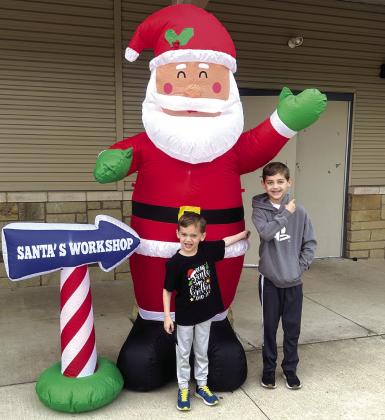 SSES Students, (L to R) Carter Ringo and Ryder Ringo, pointing the way to Santas’s Workshop.