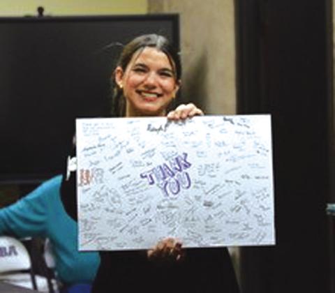 Alyssia Torres presents a “Thank You” card signed by all the art students Photo by Amanda Woerndall