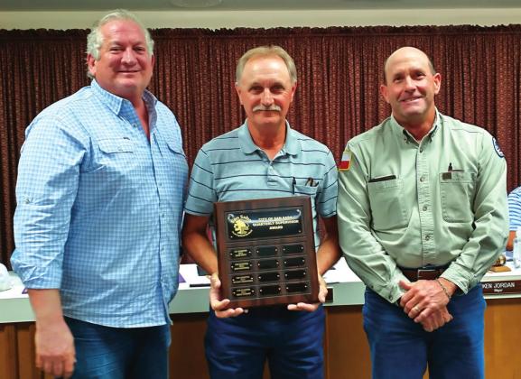 Supervisor of Quarter Bruce Stewart, Maintenance Supervisor, displays a Supervisor of the Quarter plaque with his name engraved for selection as the City's Supervisor of the Quarter, 4th Quarter of the year. He also received a gift certificate to a local restaurant. At Bruce's right is Alderman Shawn Oliver and to his left is Scott Glaze, Public Works Director, both taking part in the formal presentation. (Staff Photo)