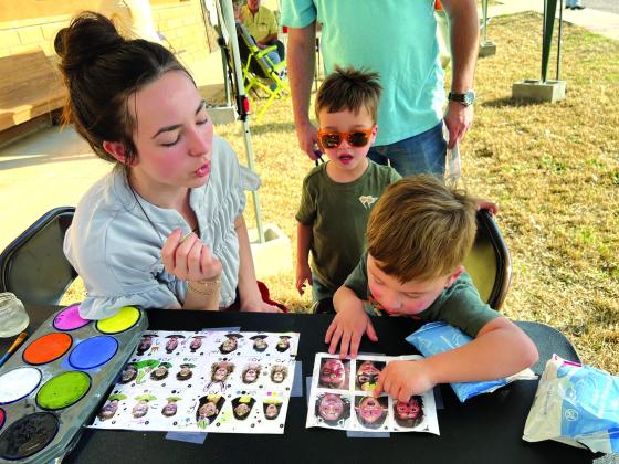 Raylee Wood bringing creativity to life, one face at a time at The Night at the Museum. Courtesy of Shara Wright