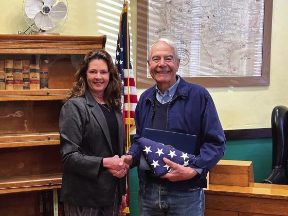 Carol Cunningham presents Judge Theodosis with a flag that flew over our nations' capitol. Photo Courtesy of Carol Cunningham