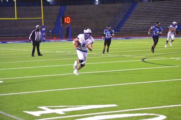 Richland Springs High School varsity football junior wide receiver Zane Capps (8) runs during the first quarter on Tuesday, January 5, on his way to a 45-yard touchdown reception.