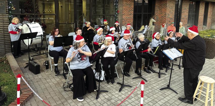 The San Saba River City Band directed by Bill Grusendorf performs each year at the Sip N’ Stroll event just prior to the Lighted Christmas Parade. Courtesy of Buddy Whitley