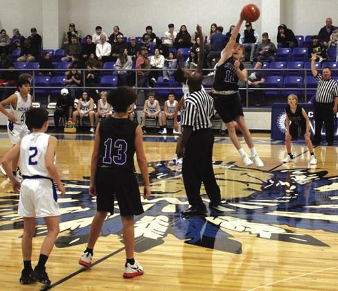 RS Evan Deeds (#12) is jumping for the ball at opening tip-off to start the game against Cherokee. Final: RS over Cherokee, 46-24