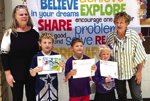 First Grade Environmental Poster Contest: Kelley Cash (teacher), Case Walts, Asher Little, Vivian Theis, Debbie Shahan (Garden Club member)