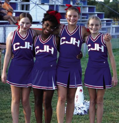 Junior high cheerleaders Tayler Parker, Ariana Sharpe, Mandi Fry, and Georgia Broyles at the game against Sidney. Courtesy Valerie Valdez