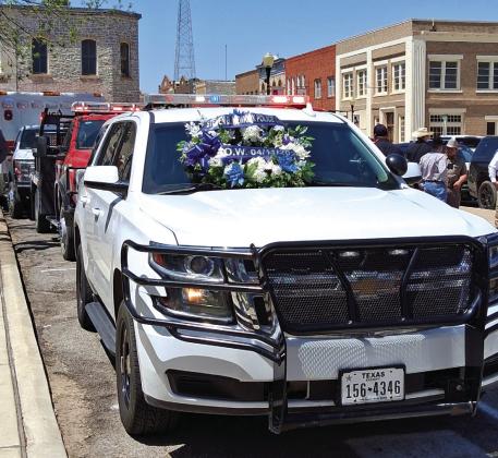 Sergeant Charlie Boyce placed this wreath on Chief Steven Newkirk’s police vehicle for the End of Watch ceremony Friday, April 11th. Photo by Carolyn Preece