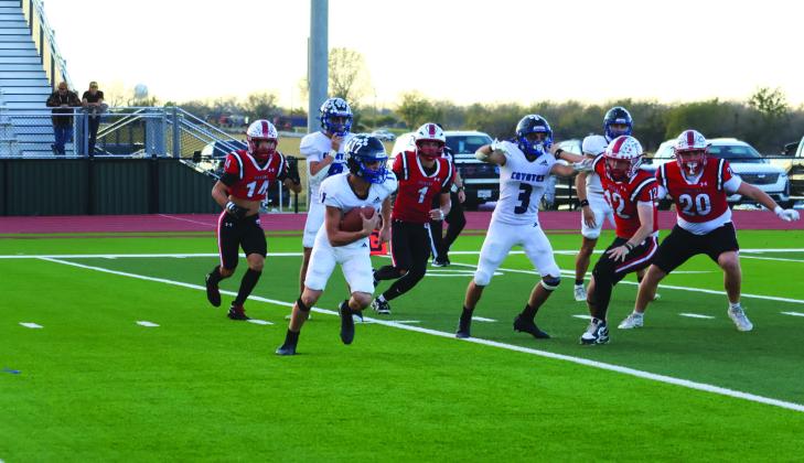 # 17 Billy Perry, # 3 Rush Norris, # 8 Ethan Deeds run an offense play for the Coyotes