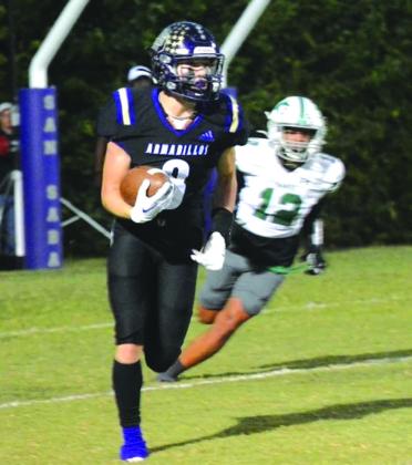 Pictured above: Armadillo Tyler Johnson takes off for a big run during last Friday night's game against Bangs. Pictures courtesy of Rita Boultinghouse