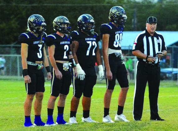 Pictured at left: Dillo Captains Lance Taylor (3) Tyler Johnson (2) Christian Ramirez (72) and Dylan Ware (88) meet midfield for the pre-game coin toss in Friday night's game against Bangs. Pictures courtesy of Rita Boultinghouse