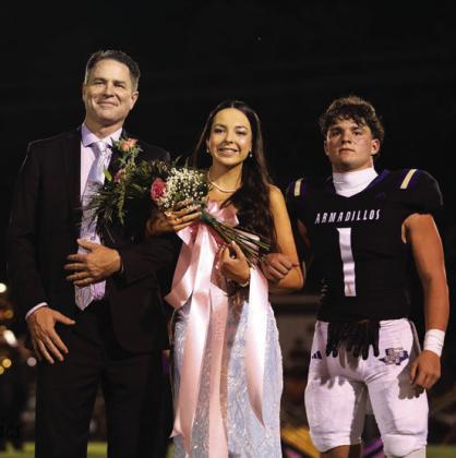 Junior Class Duchess Raylee Wood, daughter of Marcus and Paula Wood. Flower presenter is Luke Tharp, son of Jason Tharp and Tara Tharp.