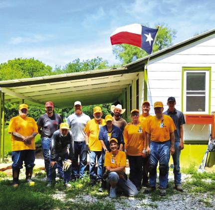 This is the Disaster Relief group from the Southern Baptists of Texas organization doing cleanup on the house where the old newspapers were found. Photo by Djuana Payton