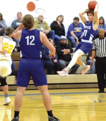 Gunner Baugh making a pass to Joey Bond in the varsity game against Rochelle Courtesy Rita Boultinghouse