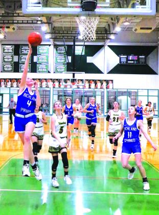 #4 Raegan Wright goes for a layup while #11 Rylie Eckert looks on. Photo courtesty of Pam Starr