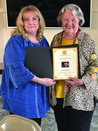 Marjean Alexander honors Sharon Hayes for serving 50 years in the San Saba Garden Club. Courtesy of Debbie Shahan
