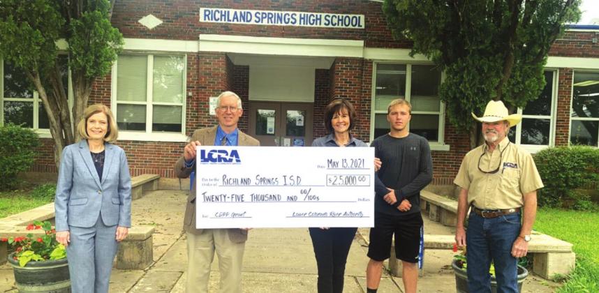 LCRA representatives present a $25,000 grant to the Richland Springs Independent School District for new playground equipment. The grant is part of LCRA’s Community Development Partnership Program. Pictured, from left to right, are: Patsy Hall, Richland Springs High School teacher; Don Fowler, Richland Springs ISD superintendent; Martha Leigh M. Whitten, LCRA Board member; Landon Burkhart, Richland Springs High School senior; and Steve Dyer, LCRA Regional Affairs representative.