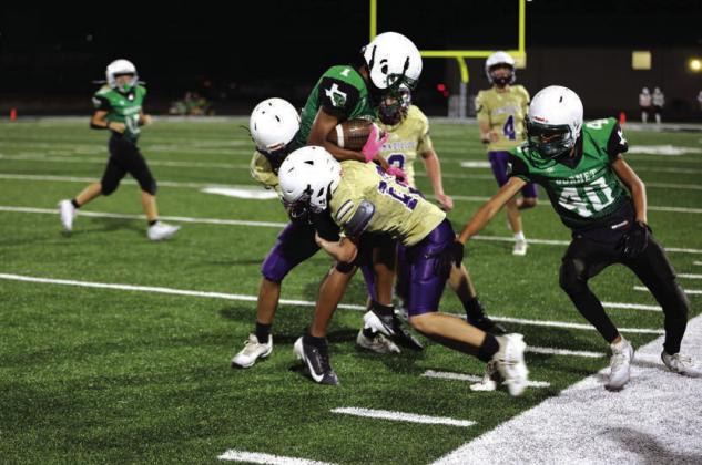 Donte Smith is making a defensive stop for the Dillos in their win against Burnet.