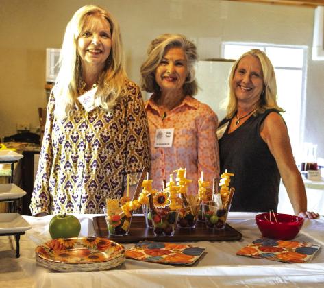 Photo of hostesses (l-r): Denise Mayfield, Betty Jo Fisher, Mona McMahan (chair) Photo courtesy of Karen Sloan