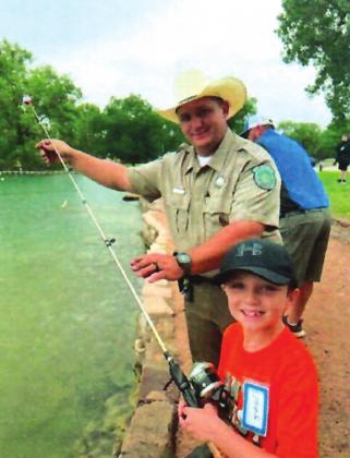 One-on-one fly-fishing lessons with a Texas Highway Patrol Trooper (pictured is Lorenzo Arroyo, Jr.) makes for an awesome and rewarding experience for a Kid Nature Kamper in 2022!