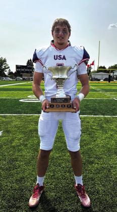 Rode Ligon holding the Team USA trophy after the 84-16 win over Canada Photo submitted by Katie Boswell