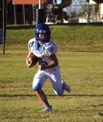 Knox Williams carrying the ball in the junior high game against Buckholts. Courtesy of Valerie Valdez