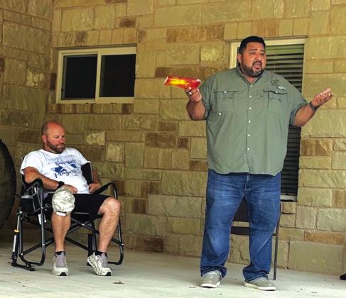 Israel preaching at the Wednesday night devotional time