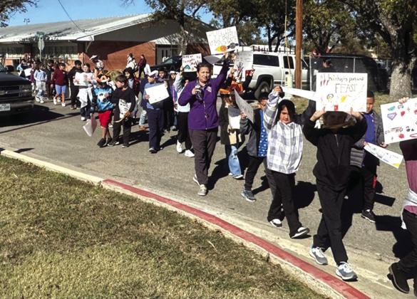 Acting as the caboose in the parade, SSES 3rd grade students are excited to share their “something good!”