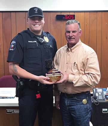 San Saba Police Chief Steven Newkirk (left) presented Steven (Lane) Haviland (right) with a graduation plaque. Courtesy of Scott Glaze