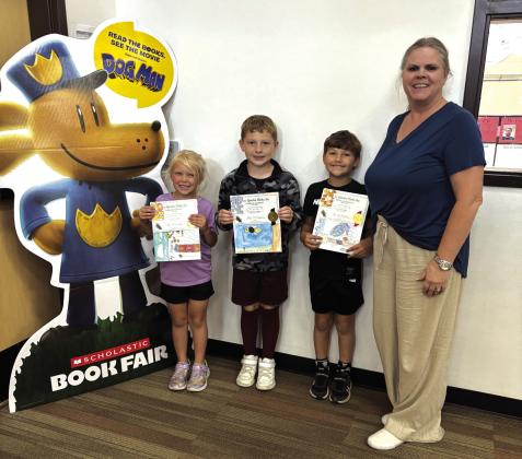 Environmental Poster Contest Winners - 1st Grade: Vivian Theis, Case Walts, Asher Little, and teacher Kelley Cash