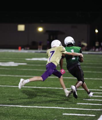 #7 Luke Bagley makes a racing sideline stop for the 8th grade Dillos in their 32-0 win against Burnet last Thursday.