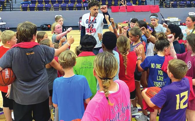 San Saba campers gather around Austin Johnson on Wednesday, June 30, during the Elite Skills Camp run by Austin Johnson's Academy of Hoops. The three-day basketball camp was held at Armadillo Arena in San Saba. (Photo courtesy of San Saba All-Sports Booster Club)