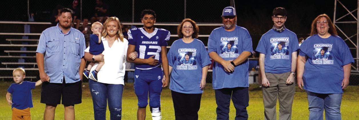 Senior nominee John Clark, escorted by Marilyn and Jim Clark, Nethaniel Minnix and Stephanie Parsons as well as Tori, Hutton, Hudson, and Mason Weaver
