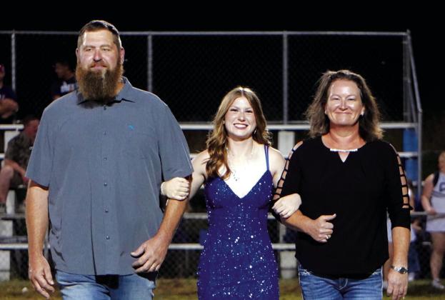Senior nominee Tilar Turman escorted by Katy and Jacob Parker