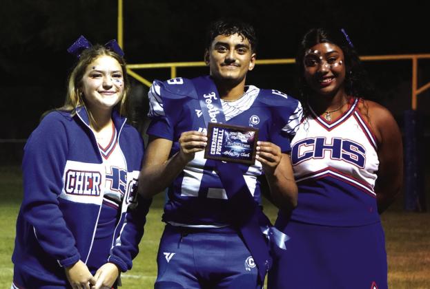 Football Beau John Clark with cheerleaders Lily Graves and Summer Davis