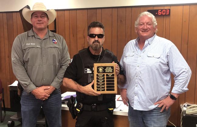 June Employee of the Month Left to right: Police Chief John Bauer; Police Officer Eric Batchelor, June Employee of the Month; and Alderman Shawn Oliver