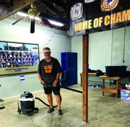 Coach Ethridge (Richland Springs Athletic Director) was seen hard at work cleaning up the weight room and getting things ready for the students. Courtesy of Sue Ransom