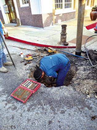 City Employee Robbie Hensley repacking the valve.