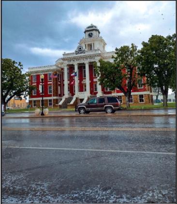 These clouds may look dark and gloomy, but with these clouds came some much needed rain. Pictured here is our court house enjoying the showers last Wednesday - and the drop in temperature! ––Staff Photo