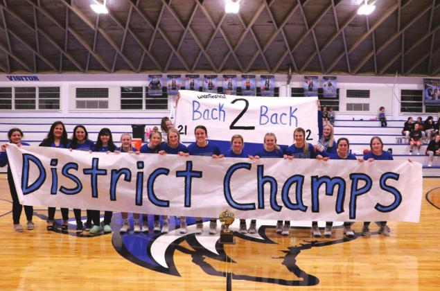 The Richland Springs High School girls varsity basketball team eagerly and happily pose with their coaches and the banner announcing their newly acquired status of Bi-District Champs. After winning the District Championship on Monday, February 14th, the Lady Coyotes went on to win the Bi-District title after beating Gustine’s Lady Tigers, 79-24. (Photo by Pam Starr)