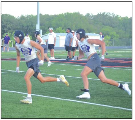 San Saba High School varsity football junior wide receiver Lane Miller (left) and senior tight end Dylan Ware (right) run routes on Monday, June 20th, during the Dillos’ 7-on-7 summer scrimmage vs. Llano High School at Jacket Stadium. (Photo by Andrew Salmi)