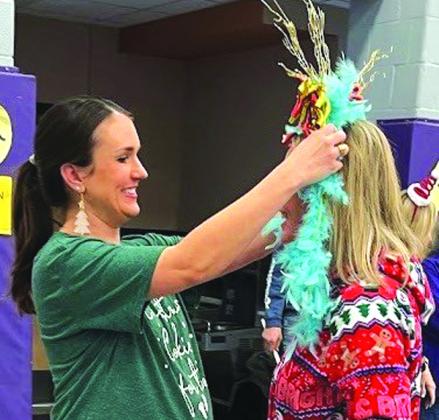 Mrs. Kallie Bush, last year’s Turkey Queen winner, crowned Mrs. Alyssa Oliver, Kindergarten Reading Language Arts teacher, the “Dry Bone Award” for the least amount of points.
